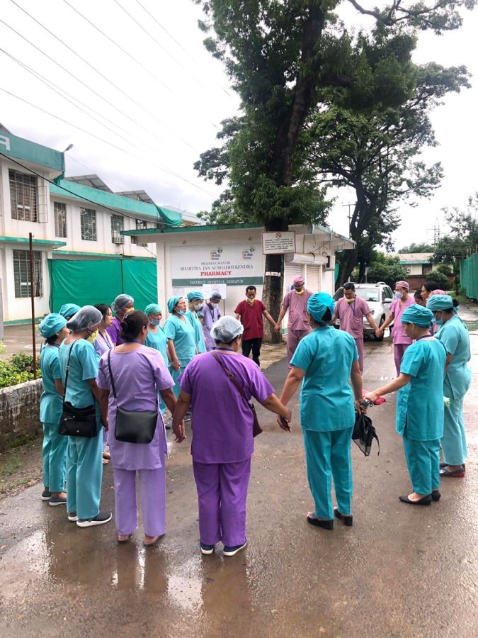 Doctors and other health workers praying in a hospital premises somewhere in Nagaland. (Photo Courtesy: Twitter)